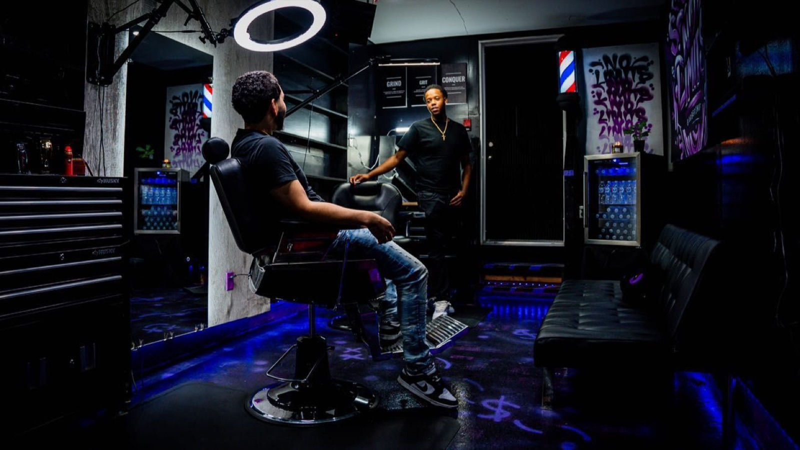 Client in the chair talking with his barber at No Limits